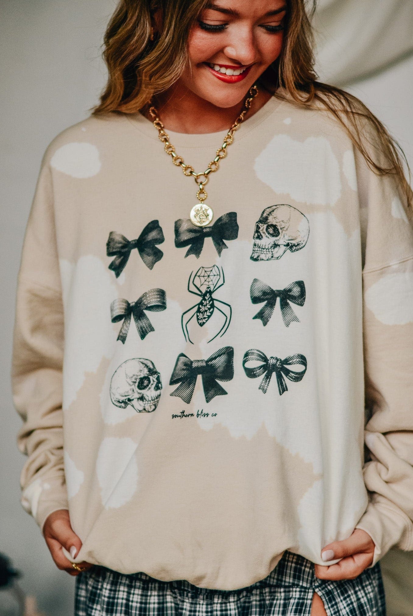 Bows and Skulls Bomba Sweatshirt-Dear Me Southern Boutique, located in DeRidder, Louisiana