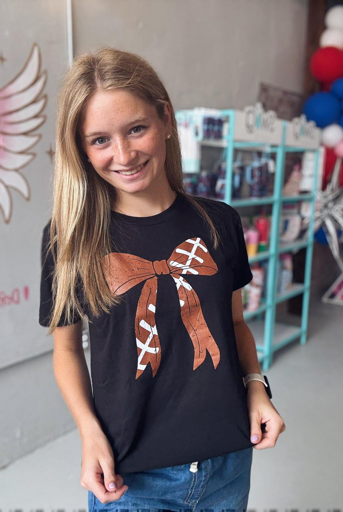 Football Bow Tee -Girls-Kids Clothing-Dear Me Southern Boutique, located in DeRidder, Louisiana