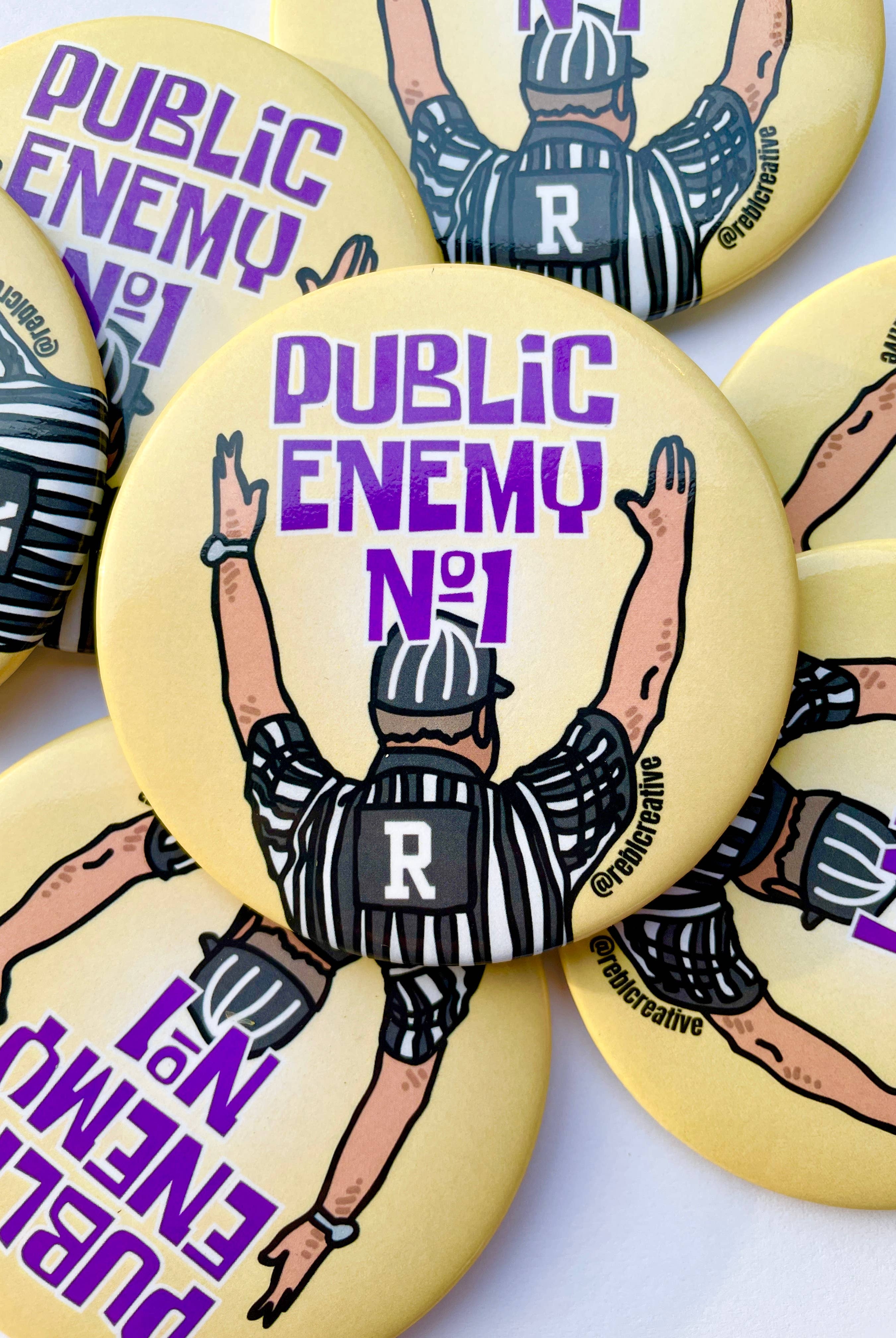 Public Enemy No. 1 - Purple & Yellow - Game Day Button-Dear Me Southern Boutique, located in DeRidder, Louisiana