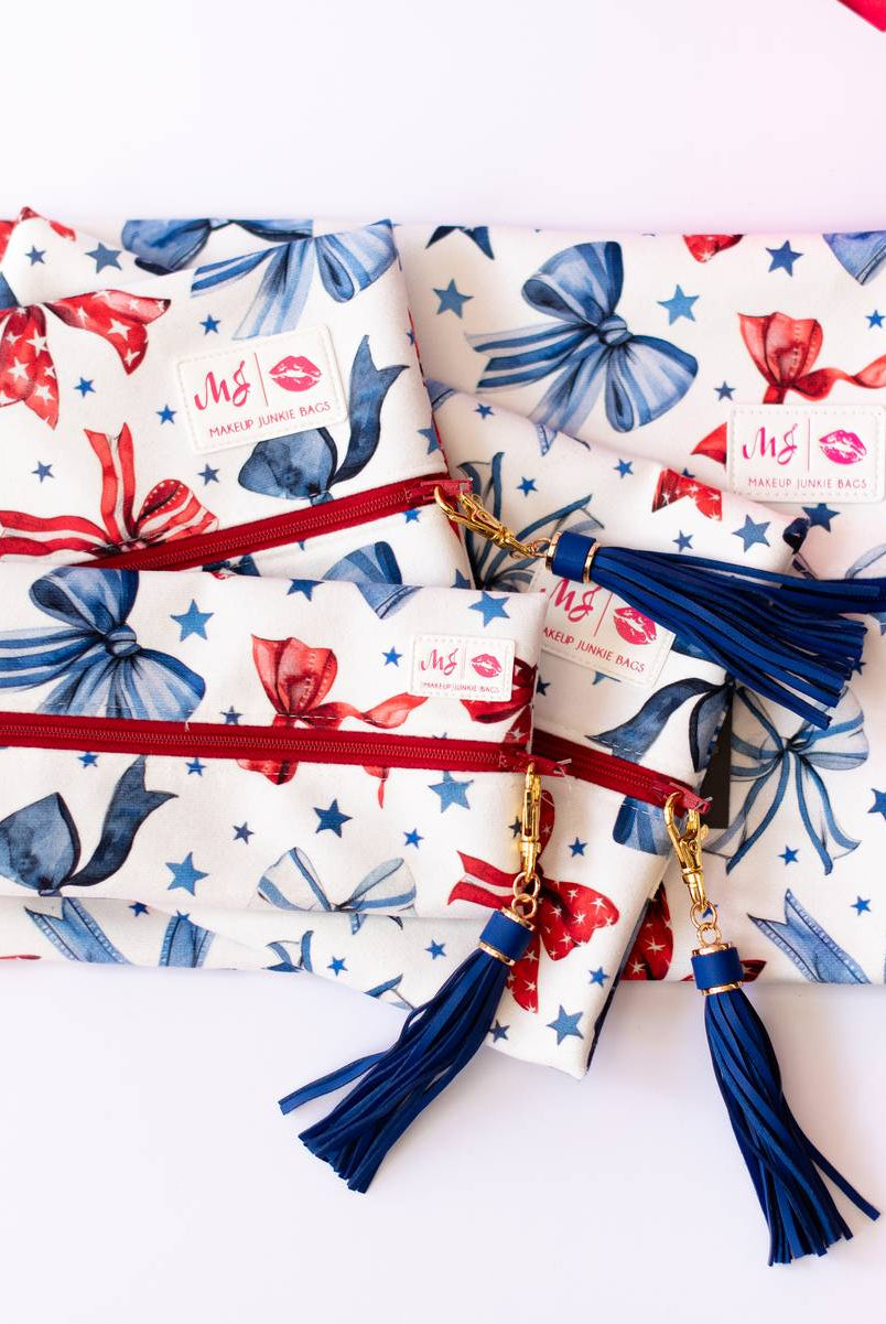 Red, White, & Bow Makeup Junkie Pouches-Makeup Bags-Dear Me Southern Boutique, located in DeRidder, Louisiana