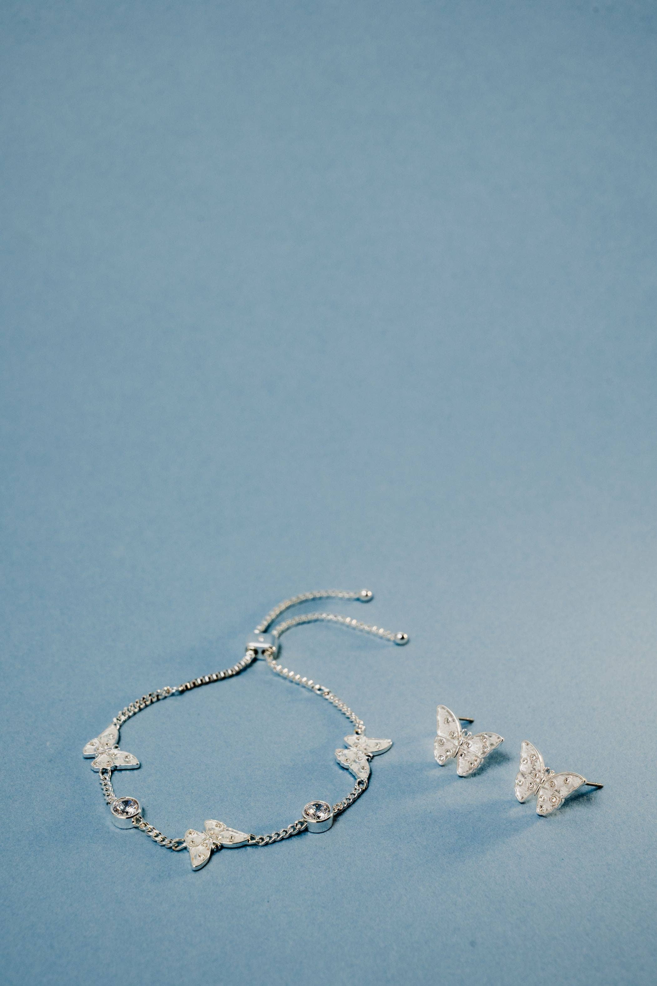 Glass Butterfly Bolo Bracelet-Jewelry - Bracelets-Dear Me Southern Boutique, located in DeRidder, Louisiana