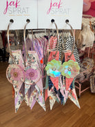 Jak Sprat Phantoms & Florals Collection: Charmed Fabulous Feather Dangles-Jewelry - Earrings-Dear Me Southern Boutique, located in DeRidder, Louisiana
