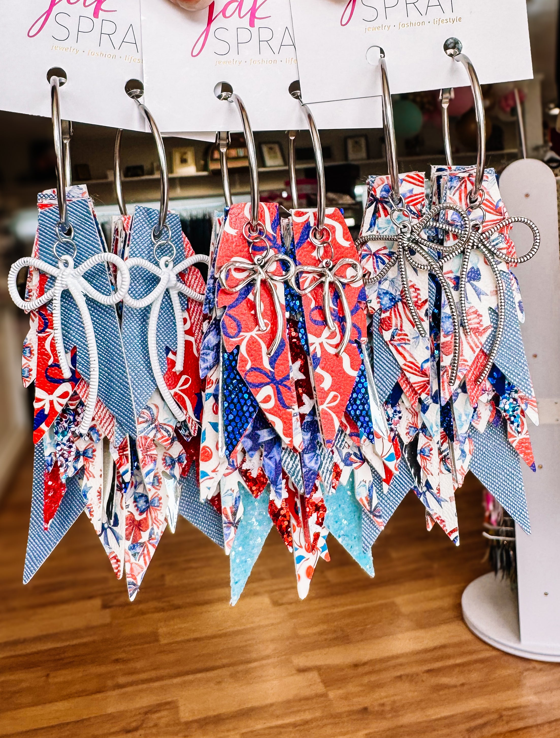 Jak Sprat Red, White, & Bows Collection: Charmed Fabulous Feather Dangles-Jewelry - Earrings-Dear Me Southern Boutique, located in DeRidder, Louisiana