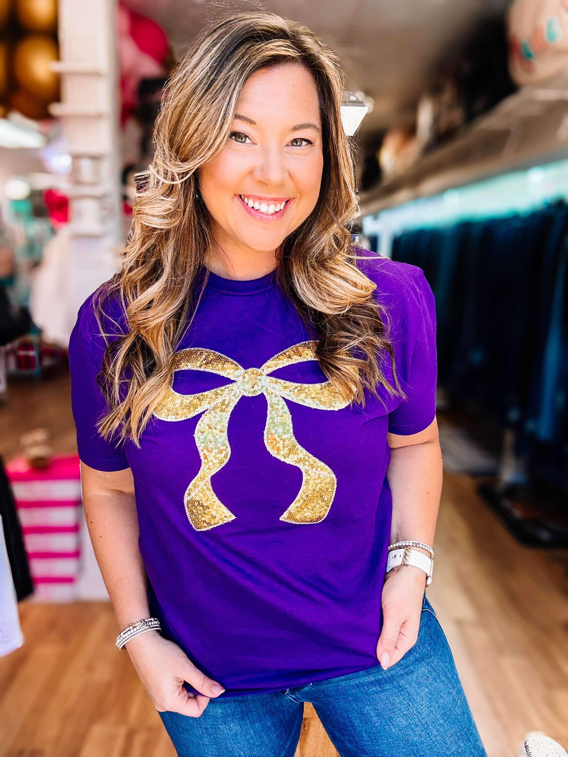 Put A Bow On It Sequin Tee - Purple/Gold-Graphic Tops-Dear Me Southern Boutique, located in DeRidder, Louisiana