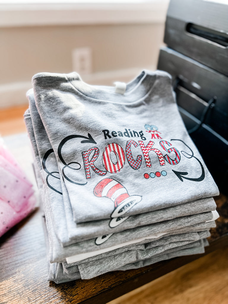 Reading Rocks Children's Tee-Dear Me Southern Boutique, located in DeRidder, Louisiana
